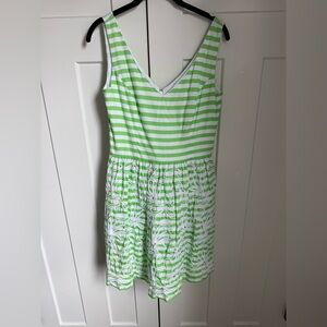 Lilly Pulitzer Roswell fit and flare dress in a green and white striped pattern.